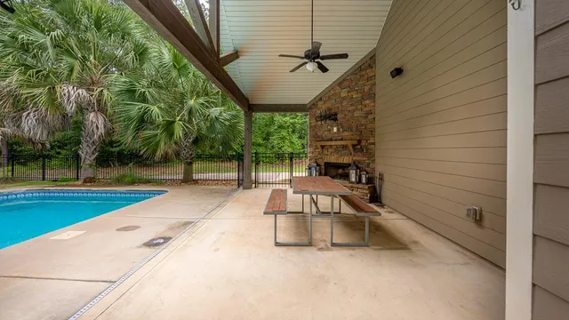 a view of swimming pool with a patio