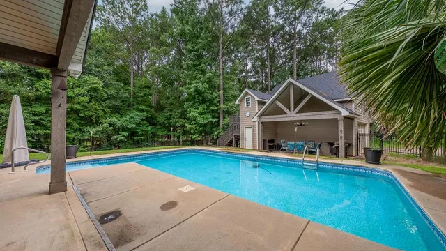 a front view of a house with swimming pool