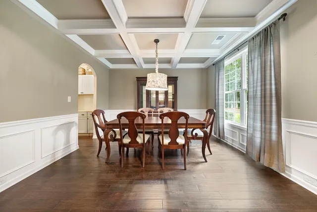 a view of a dining room with furniture window and outside view