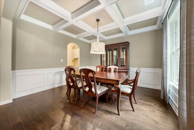 a view of a dining room with furniture and window