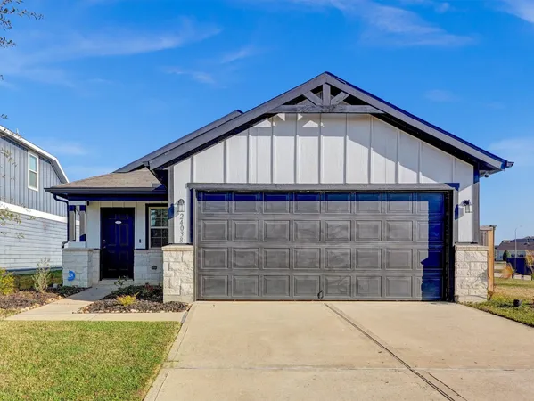 a front view of a house with garage