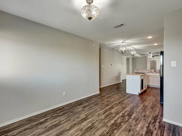 a view of a kitchen with a sink and cabinets