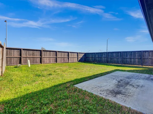 a view of yard with swimming pool and outdoor space