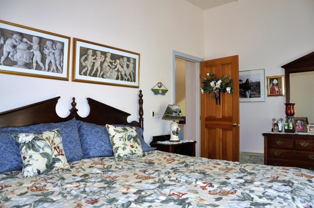16 Baker Road Wellfleet, MA 02667 - Photo 16 of 25 a bedroom with a bed and wooden floor