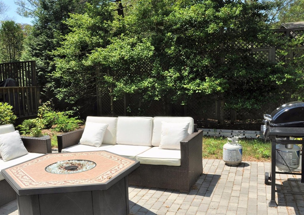 16 Baker Road Wellfleet, MA 02667 - Photo 23 of 25 a view of a patio with couches table and chairs and potted plants