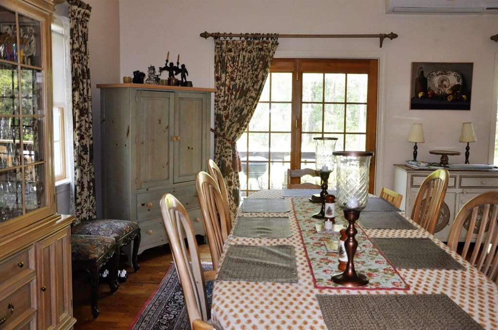 16 Baker Road Wellfleet, MA 02667 - Photo 5 of 25 a living room with furniture a window and a chandelier