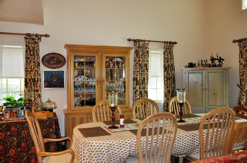 16 Baker Road Wellfleet, MA 02667 - Photo 6 of 25 a view of a dining room with furniture and chandelier