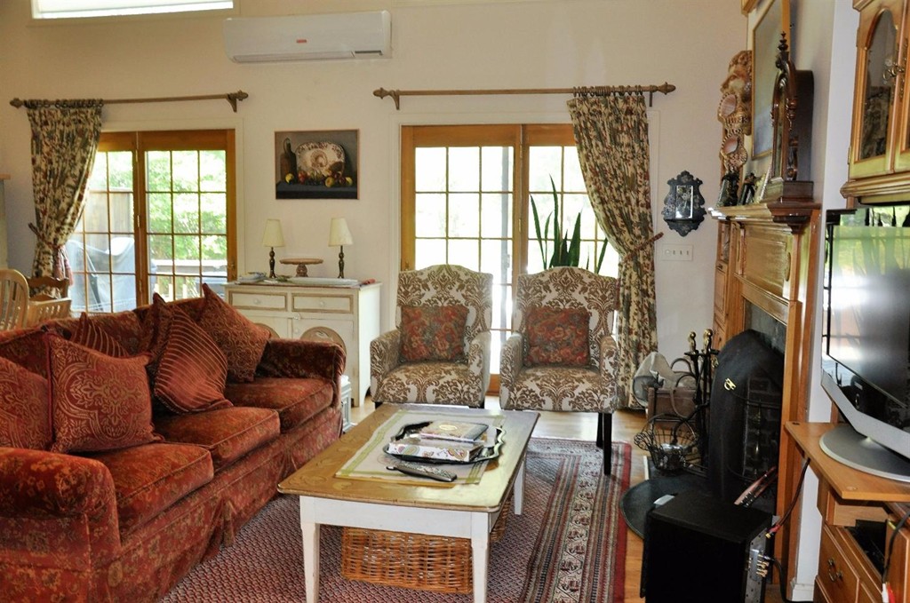 16 Baker Road Wellfleet, MA 02667 - Photo 7 of 25 a living room with furniture and a flat screen tv