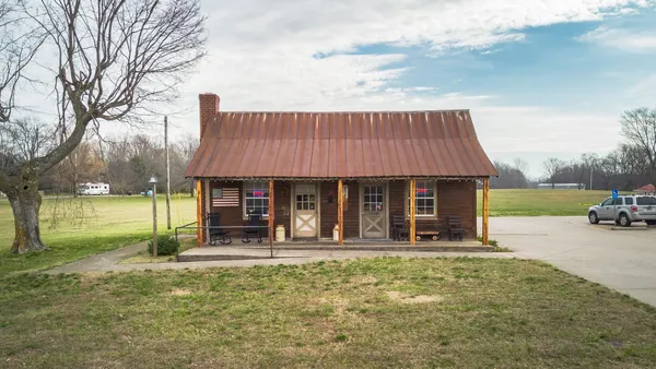 a view of a garage with table and chairs
