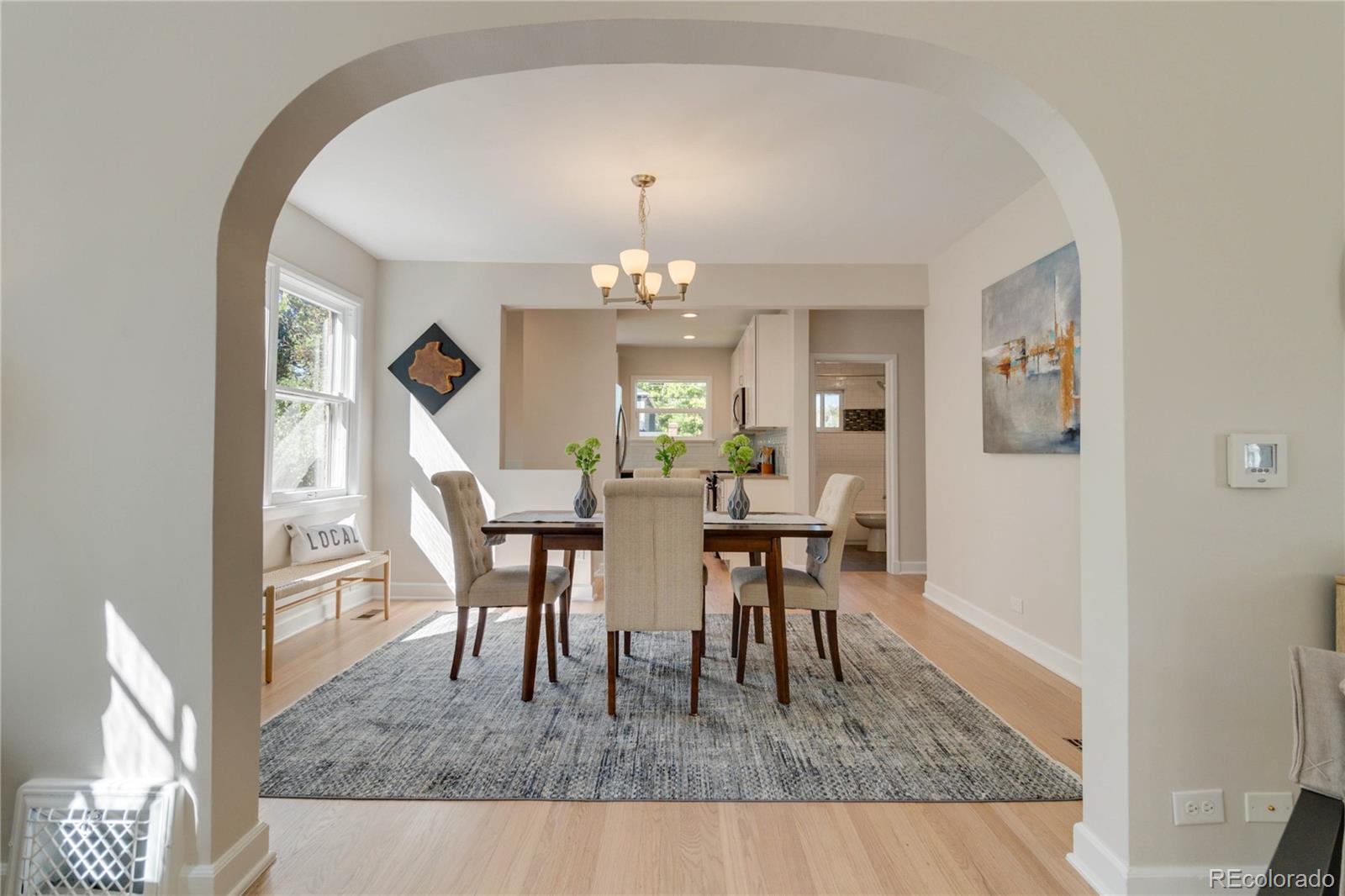 1325 Dahlia Street Denver, CO 80220 - Photo 11 of 44 a view of a dining room with furniture and chandelier
