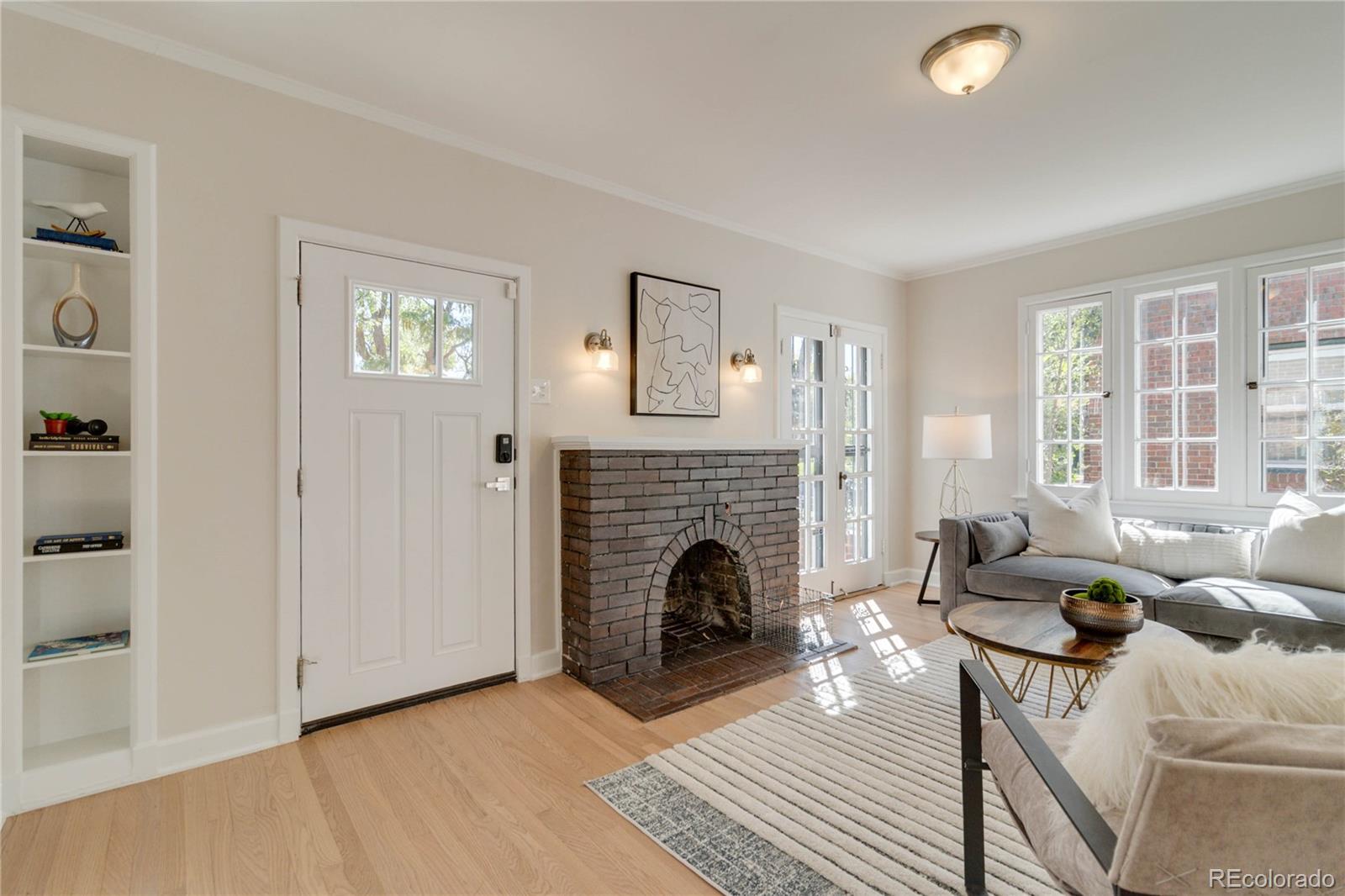 1325 Dahlia Street Denver, CO 80220 - Photo 21 of 44 a living room with furniture and a fireplace