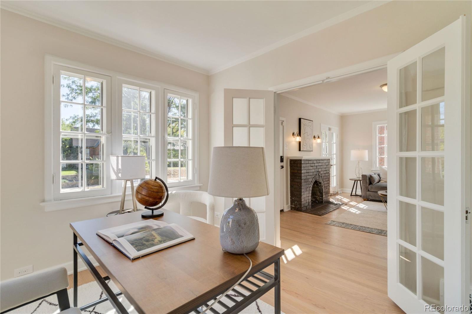 1325 Dahlia Street Denver, CO 80220 - Photo 22 of 44 a living room with furniture and a window