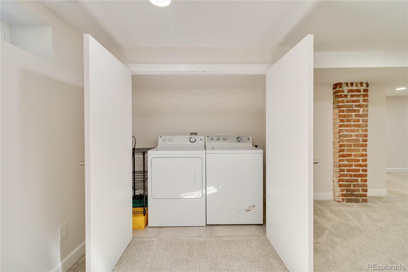 1325 Dahlia Street Denver, CO 80220 - Photo 29 of 44 a utility room with dryer and washer