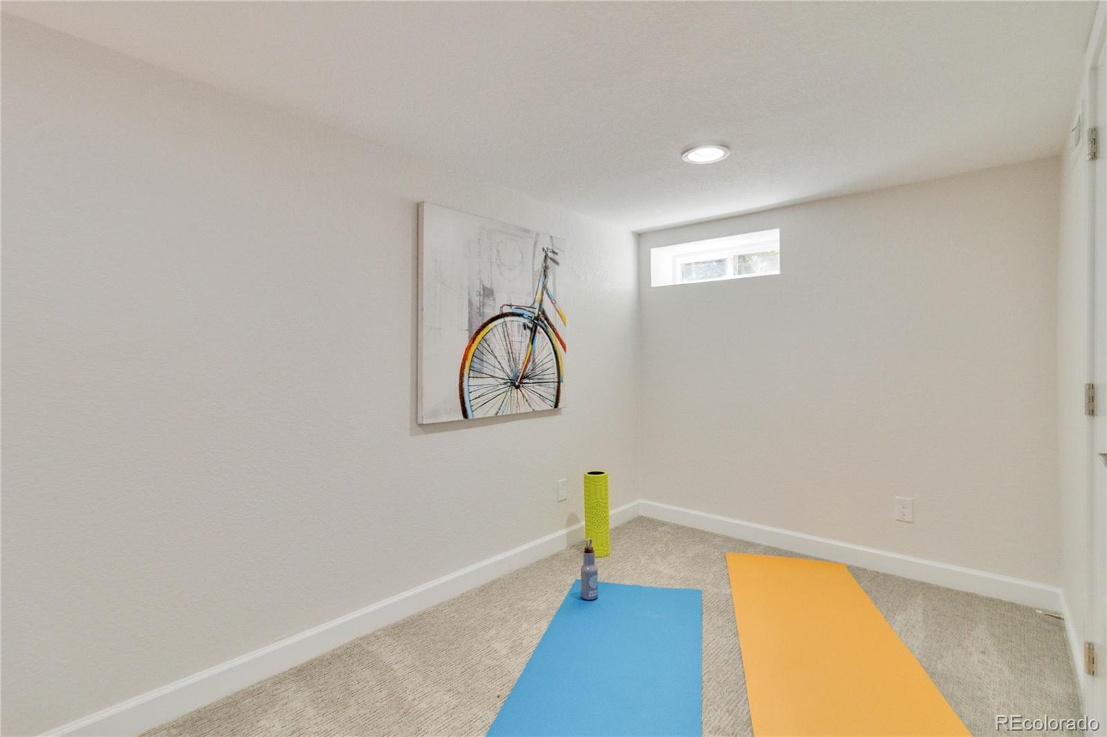 1325 Dahlia Street Denver, CO 80220 - Photo 31 of 44 a view of a room with wooden floor