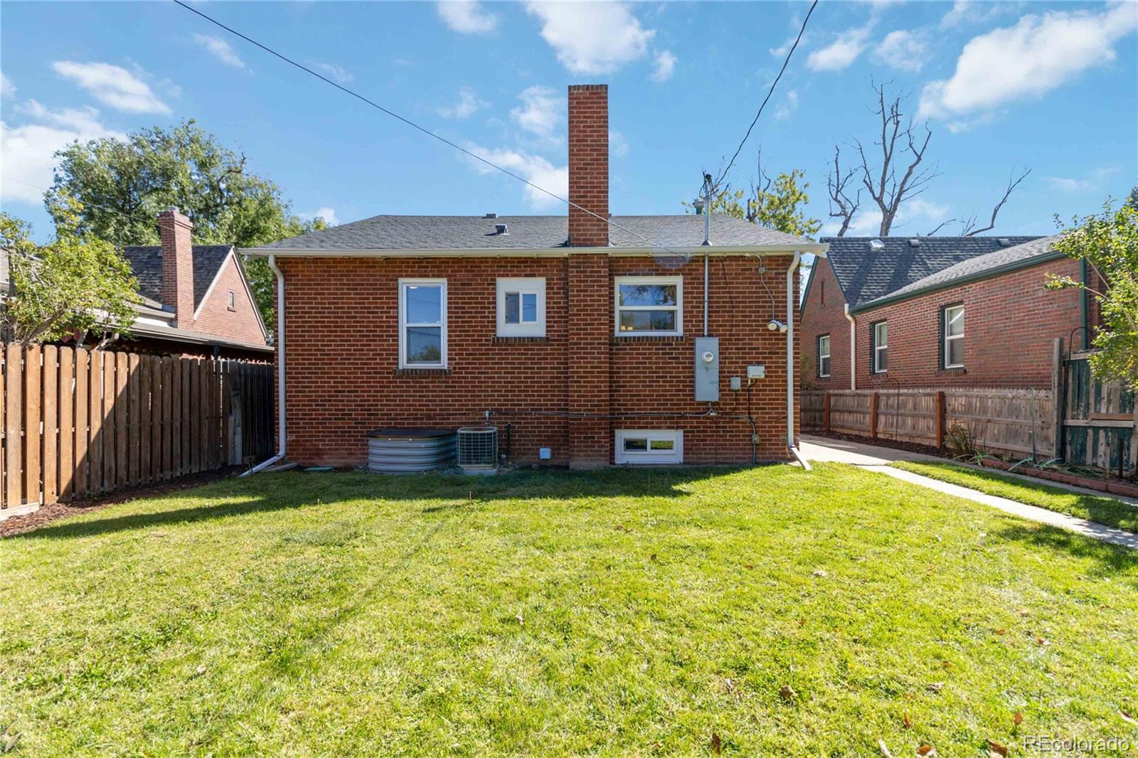 1325 Dahlia Street Denver, CO 80220 - Photo 38 of 44 a view of a house with a yard