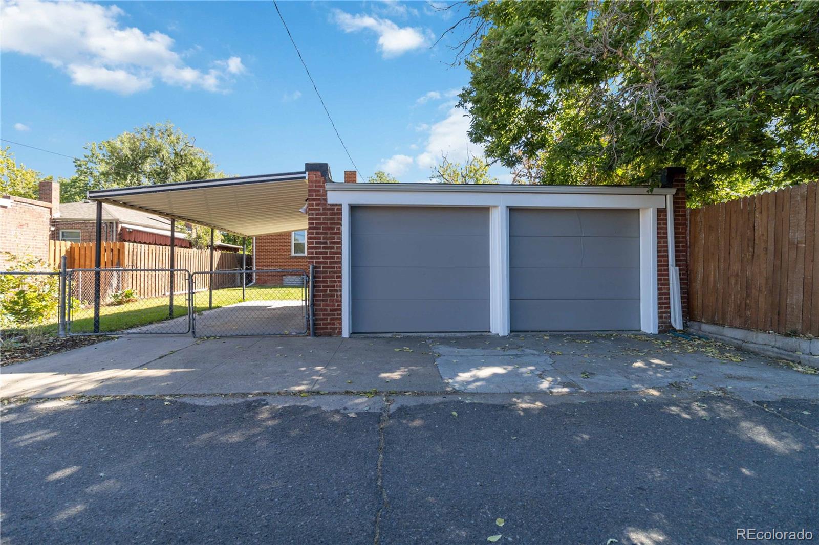 1325 Dahlia Street Denver, CO 80220 - Photo 41 of 44 a view of a parking space with a street