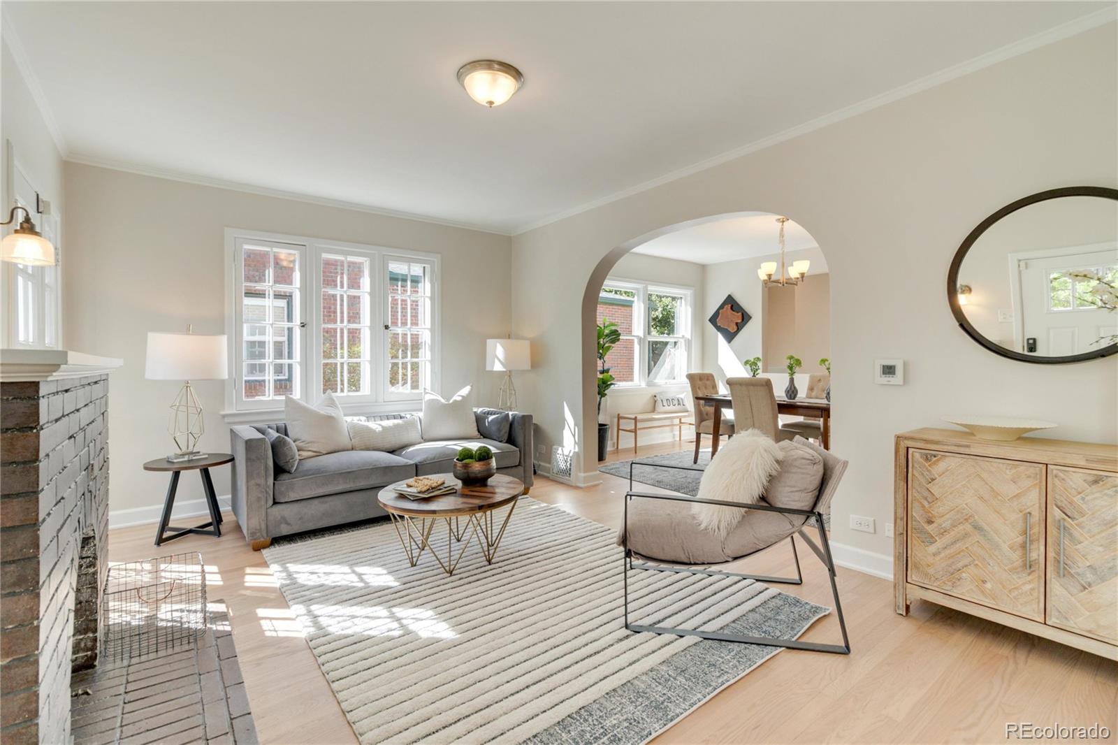 1325 Dahlia Street Denver, CO 80220 - Photo 6 of 44 a living room with furniture and a large window