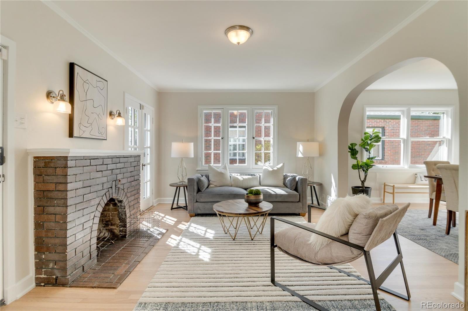1325 Dahlia Street Denver, CO 80220 - Photo 7 of 44 a living room with furniture and a fireplace
