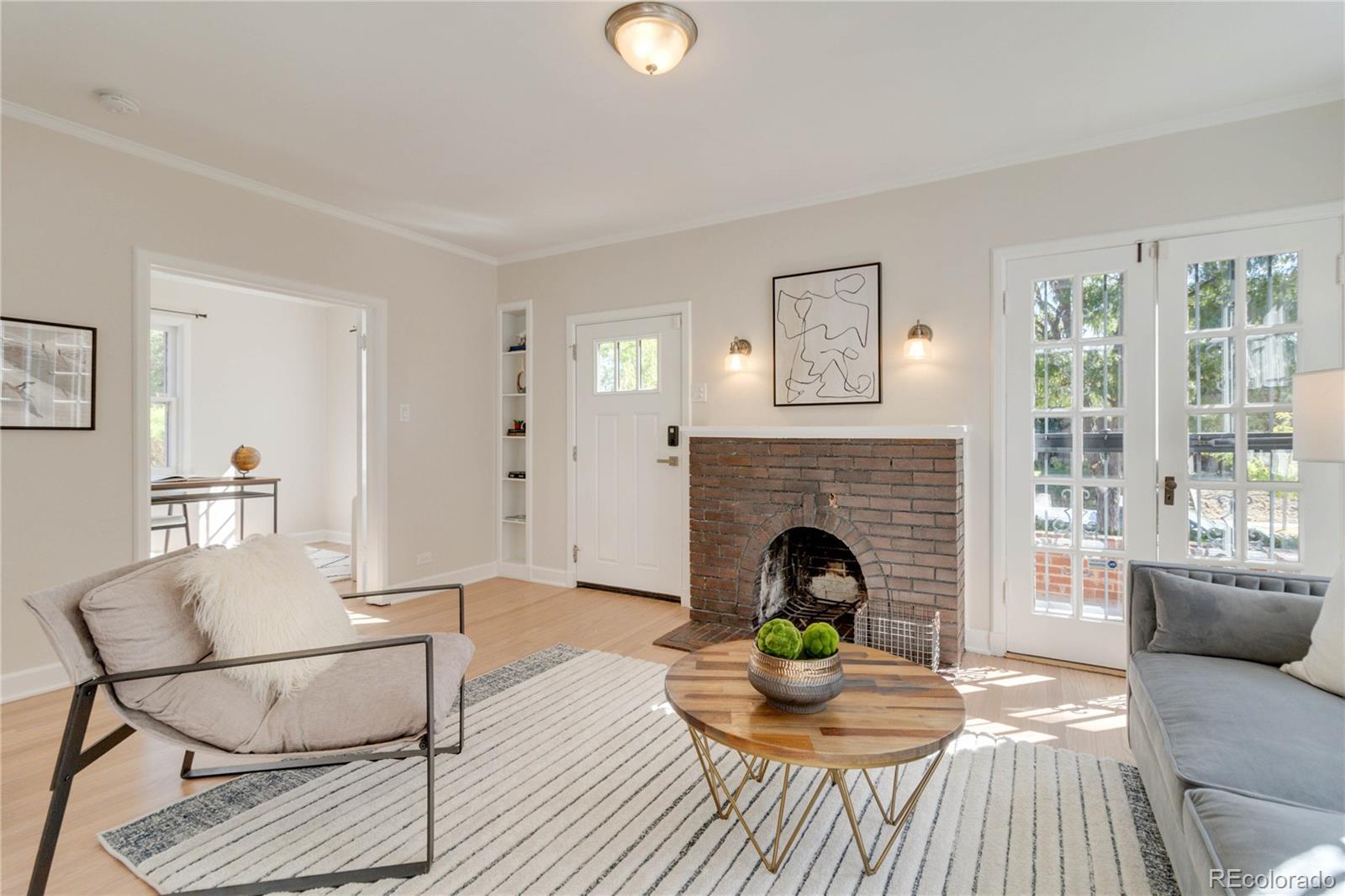 1325 Dahlia Street Denver, CO 80220 - Photo 9 of 44 a living room with furniture and a fireplace
