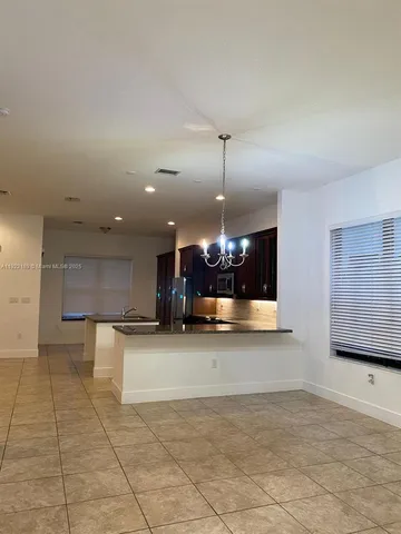 a view of house with outdoor space and lake view