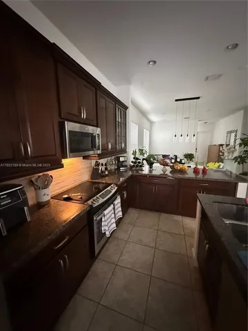 a bathroom with a toilet a sink and a mirror