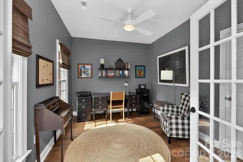 a bedroom with furniture and a window