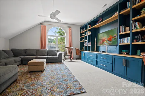 a living room with furniture window and flat screen tv
