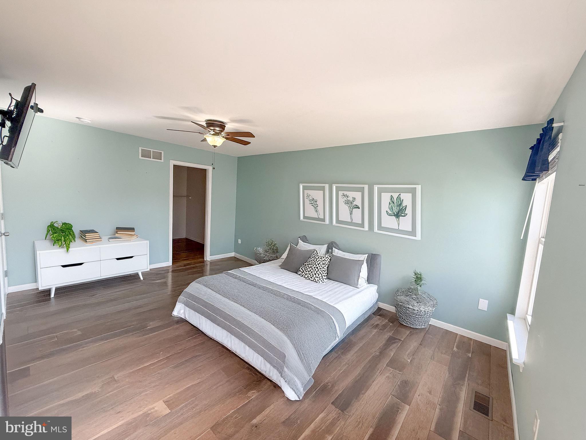 121 Chestnut Drive Elkton, MD 21921 - Photo 12 of 20 a bedroom with a bed and a chandelier