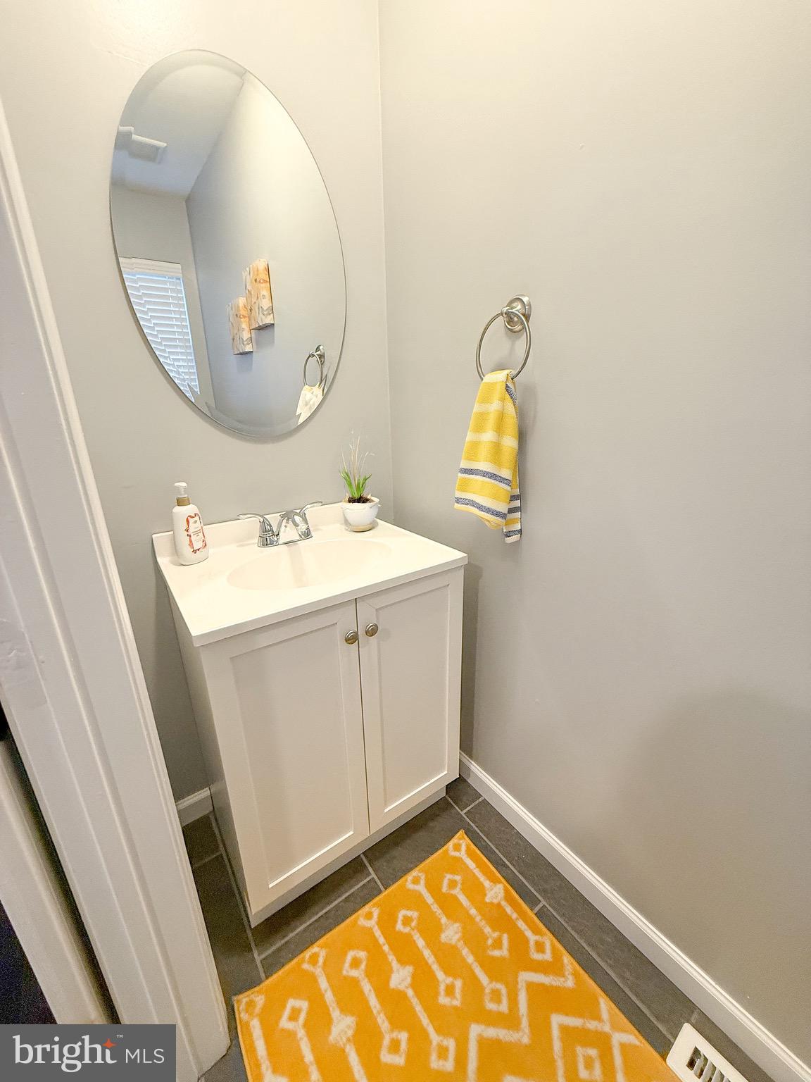 121 Chestnut Drive Elkton, MD 21921 - Photo 8 of 20 a bathroom with a sink mirror and vanity