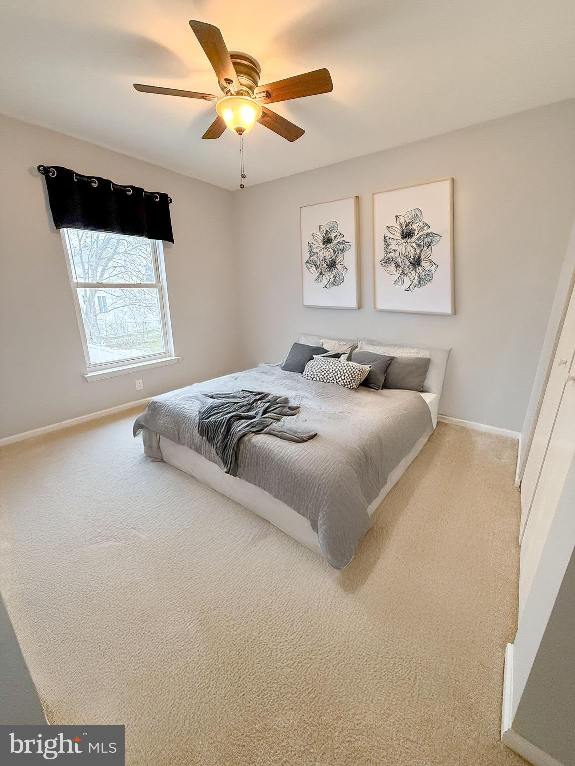 121 Chestnut Drive Elkton, MD 21921 - Photo 10 of 20 a bedroom with a large bed and a window