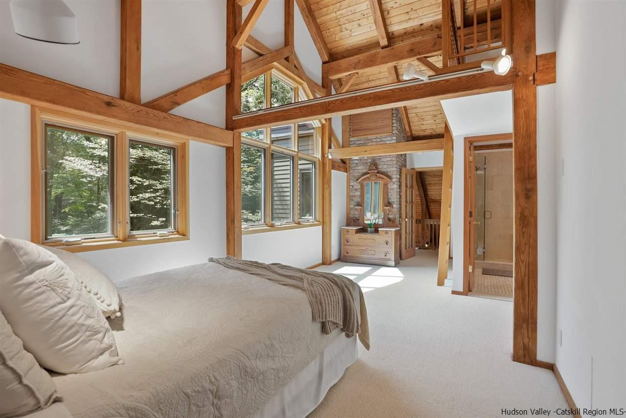 48 Rock Ridge Road New Paltz, NY 12561 - Photo 19 of 35 a bed sitting in front of a window