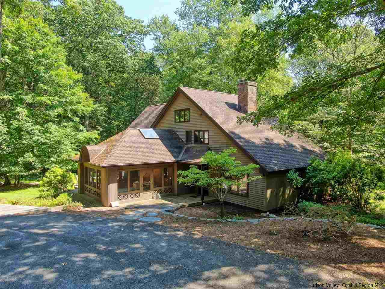 48 Rock Ridge Road New Paltz, NY 12561 - Photo 2 of 35 a front view of a house with a garden