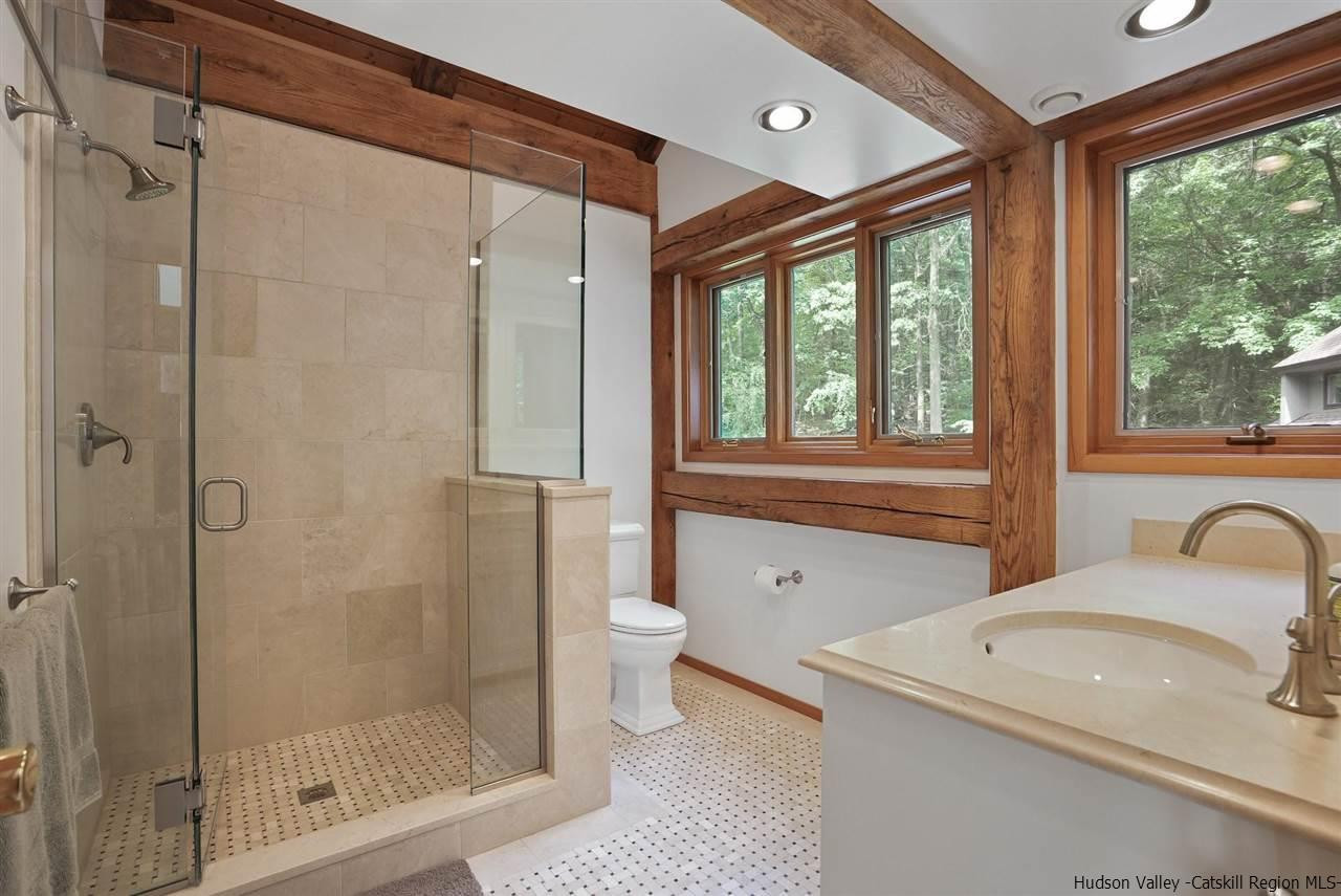 48 Rock Ridge Road New Paltz, NY 12561 - Photo 25 of 35 a bathroom with a granite countertop sink toilet and shower
