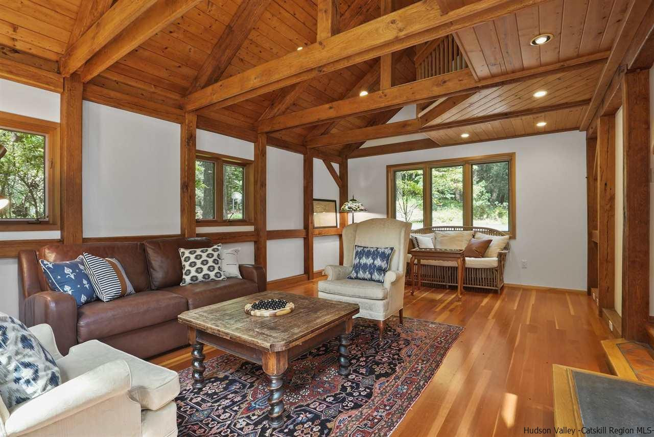 48 Rock Ridge Road New Paltz, NY 12561 - Photo 7 of 35 a living room with furniture and a wooden floor