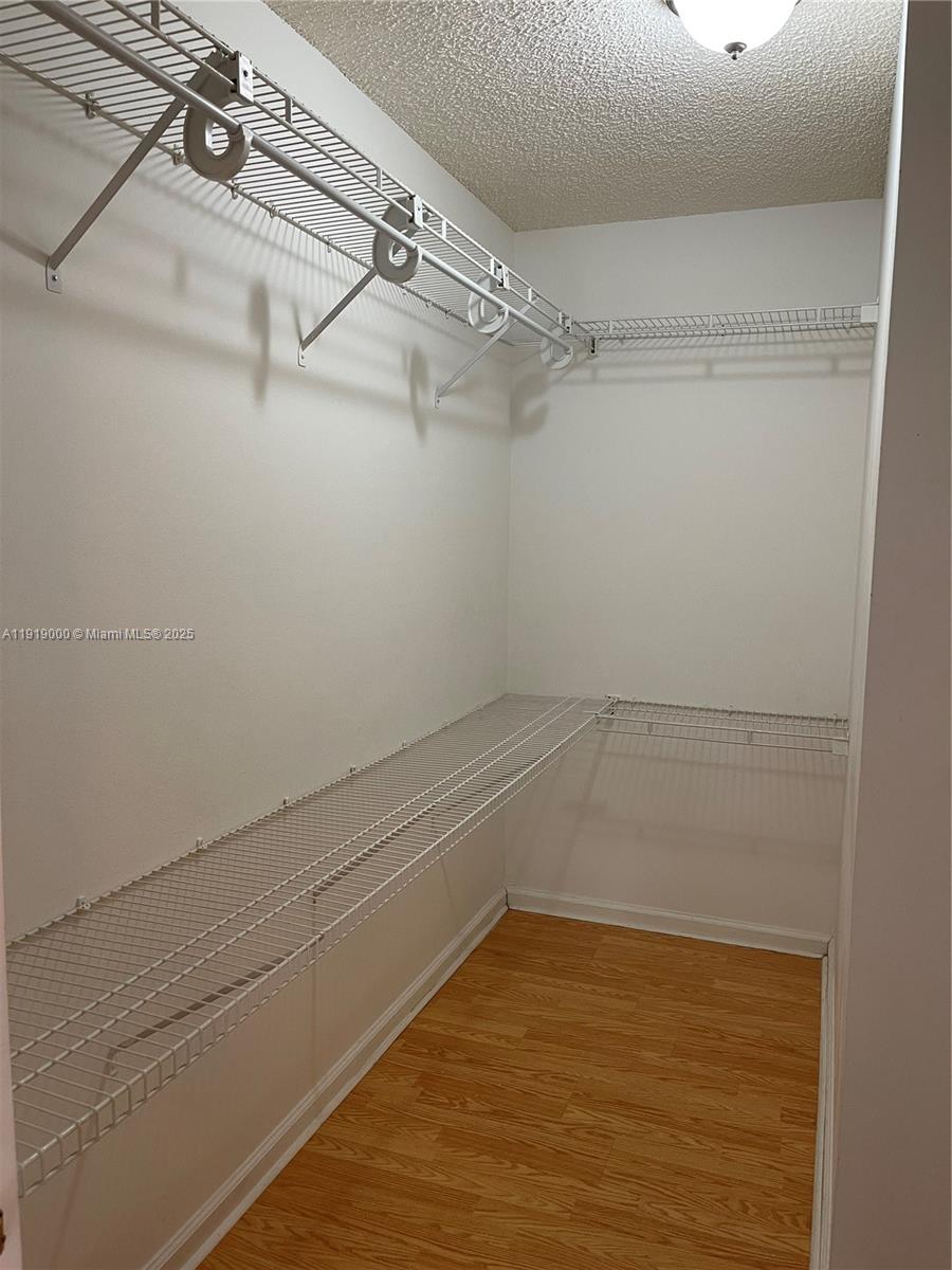 11740 Southwest 19th Street, Unit 11740 Miramar, FL 33025 - Photo 11 of 29 a view of a room with racks on the wall