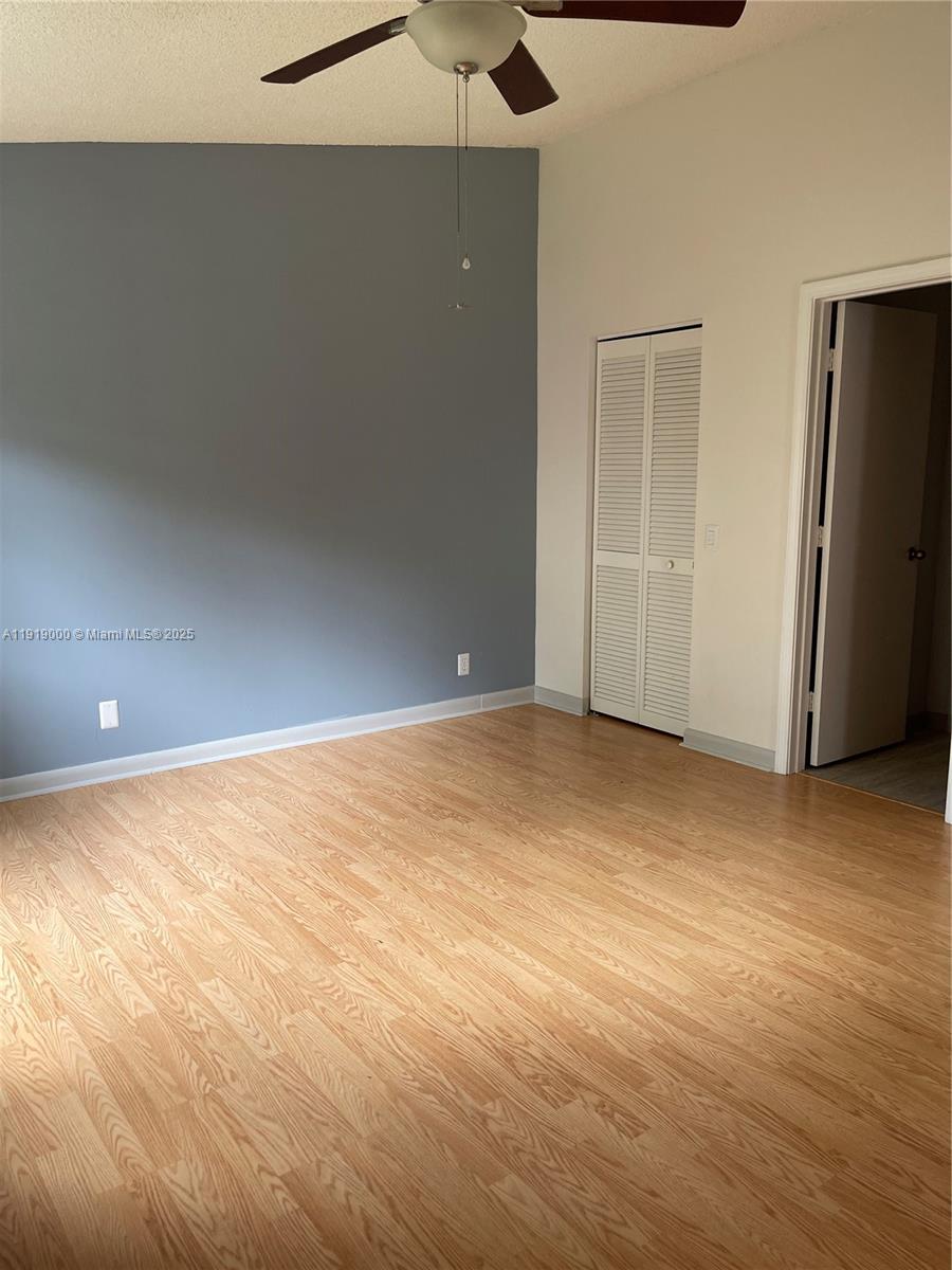 11740 Southwest 19th Street, Unit 11740 Miramar, FL 33025 - Photo 12 of 29 wooden floor in an empty room