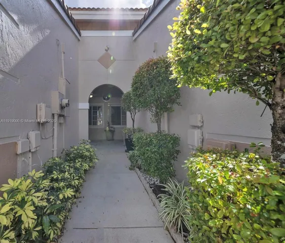 a view of a pathway in front of house