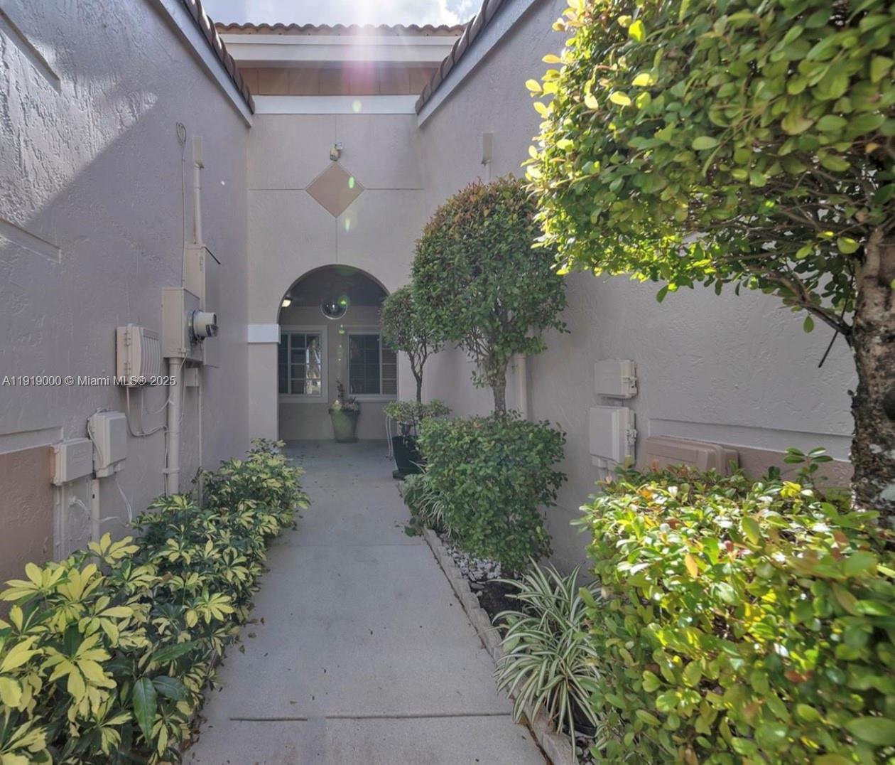 11740 Southwest 19th Street, Unit 11740 Miramar, FL 33025 - Photo 2 of 29 a view of a pathway in front of house
