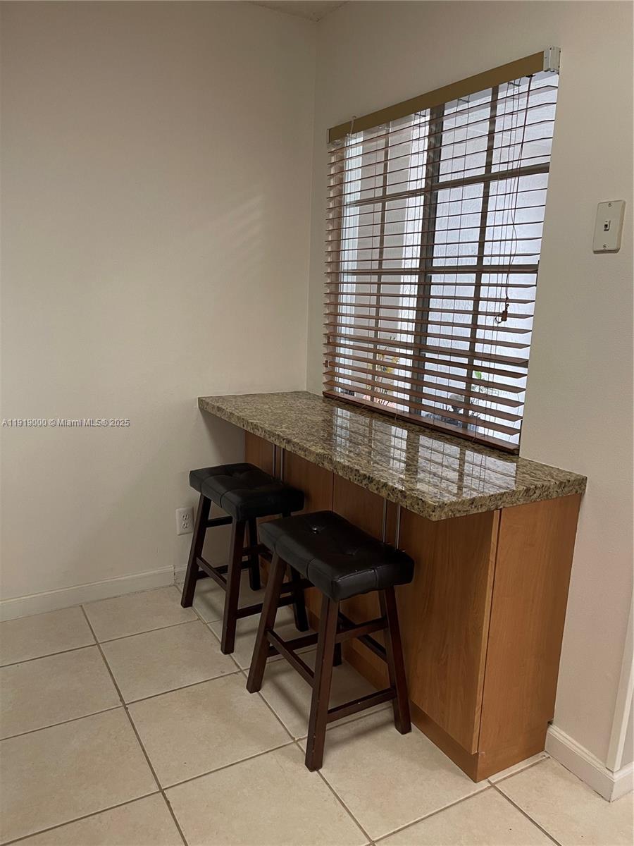 11740 Southwest 19th Street, Unit 11740 Miramar, FL 33025 - Photo 21 of 29 a view of a workspace with furniture