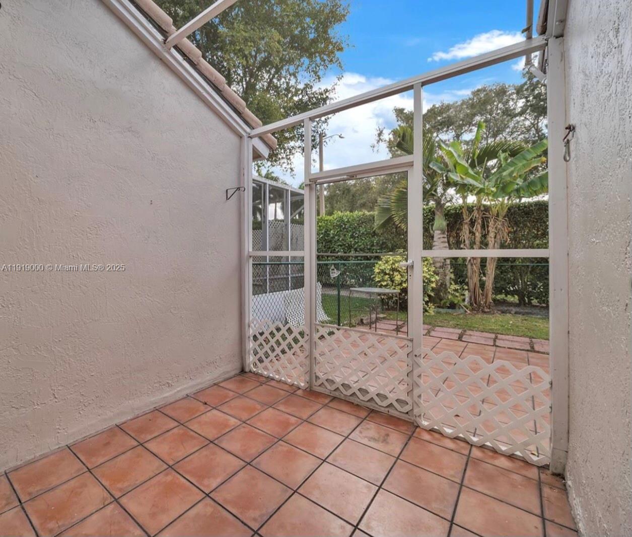11740 Southwest 19th Street, Unit 11740 Miramar, FL 33025 - Photo 22 of 29 a view of a room with wooden floor and iron stairs