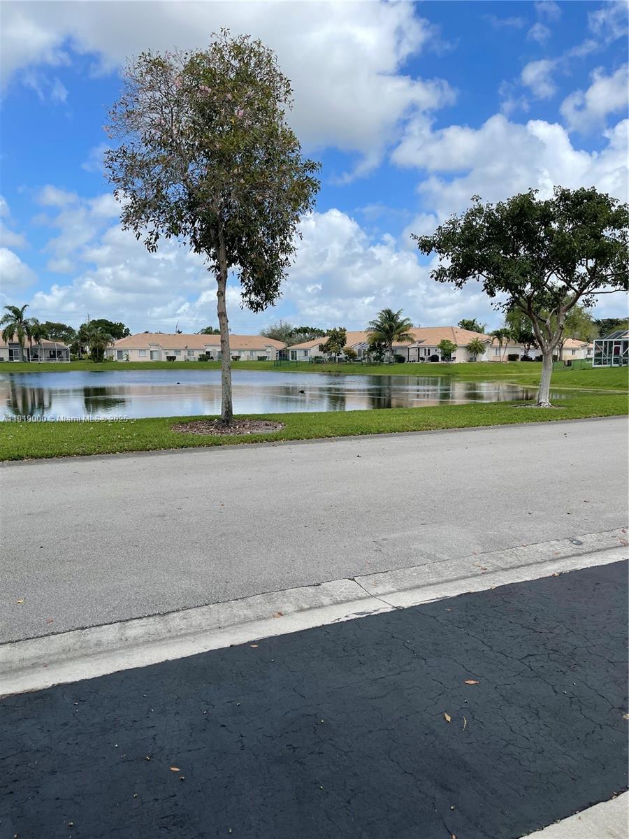 11740 Southwest 19th Street, Unit 11740 Miramar, FL 33025 - Photo 28 of 29 front view of a house with a big yard