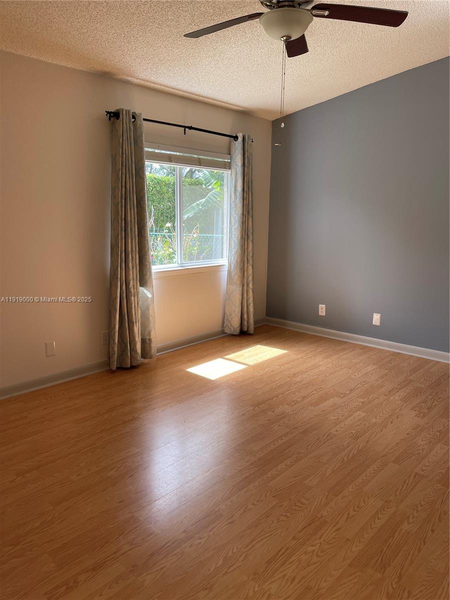 11740 Southwest 19th Street, Unit 11740 Miramar, FL 33025 - Photo 7 of 29 an empty room with a empty space and windows