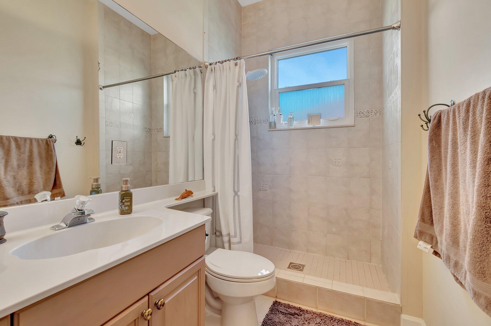 8200 Muirhead Circle Boynton Beach, FL 33472 - Photo 36 of 110 a bathroom with a sink a toilet and shower