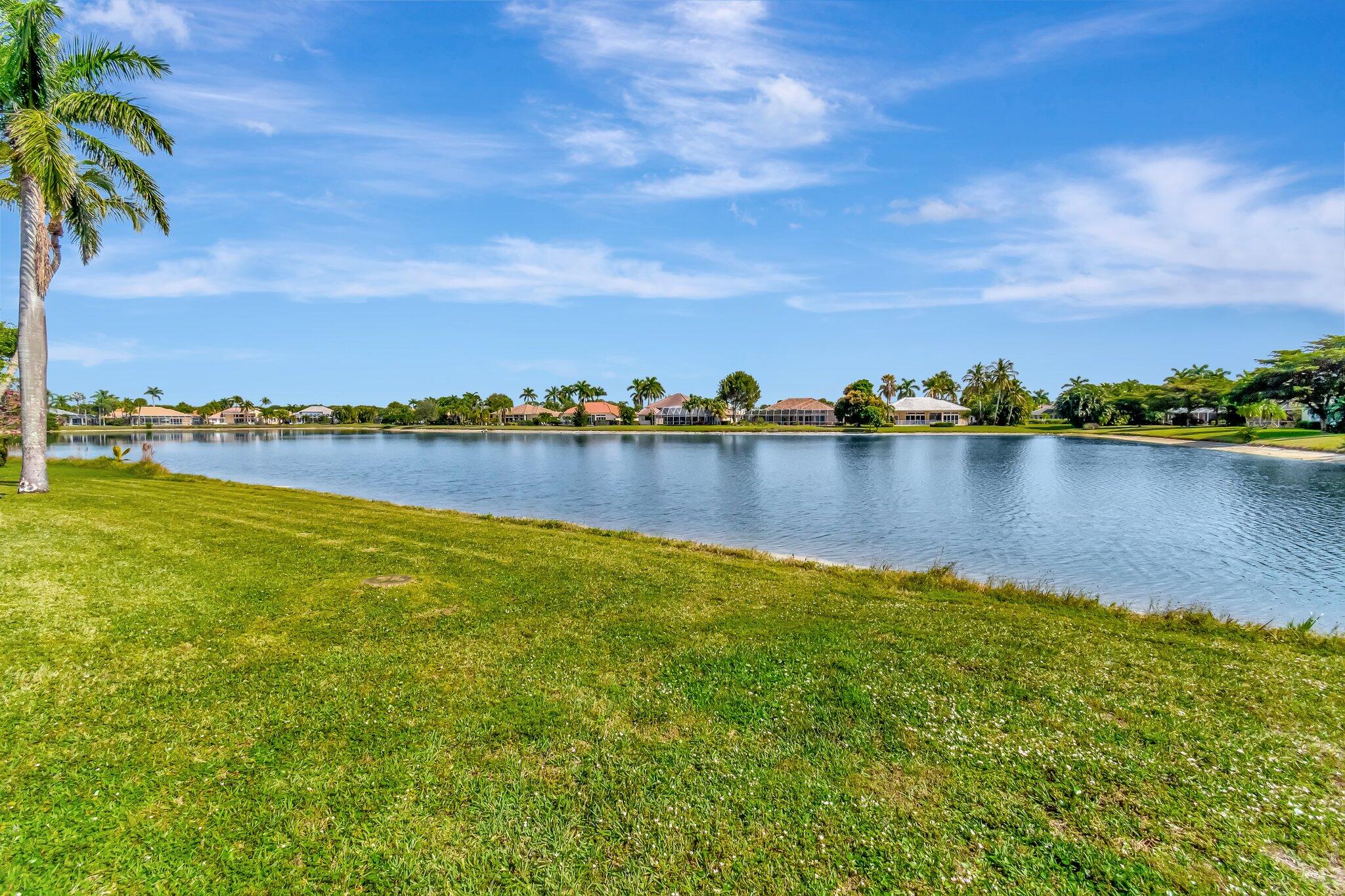 8200 Muirhead Circle Boynton Beach, FL 33472 - Photo 54 of 110 a view of a lake with houses in the background