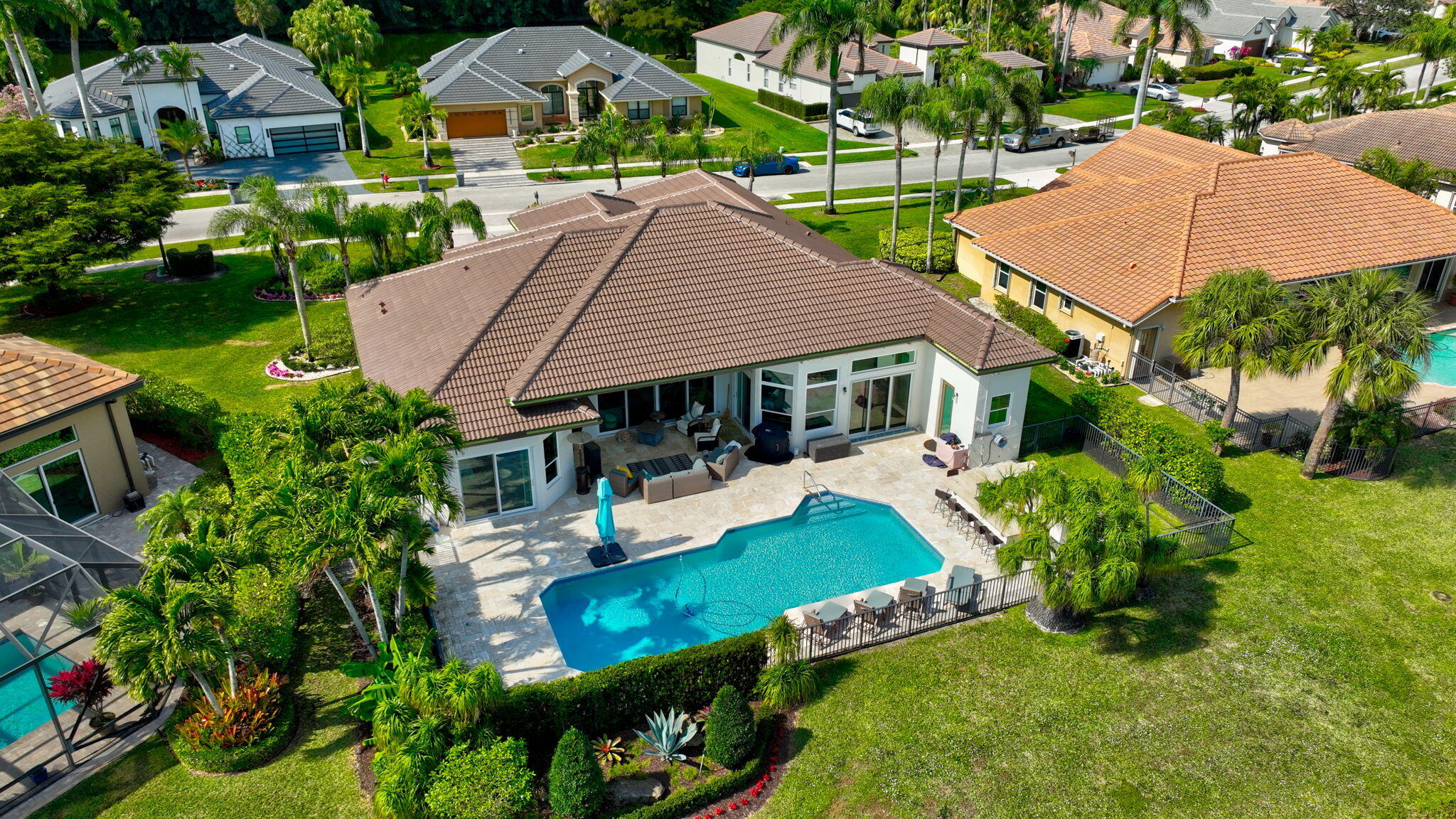 8200 Muirhead Circle Boynton Beach, FL 33472 - Photo 69 of 110 a aerial view of a house with swimming pool garden and patio