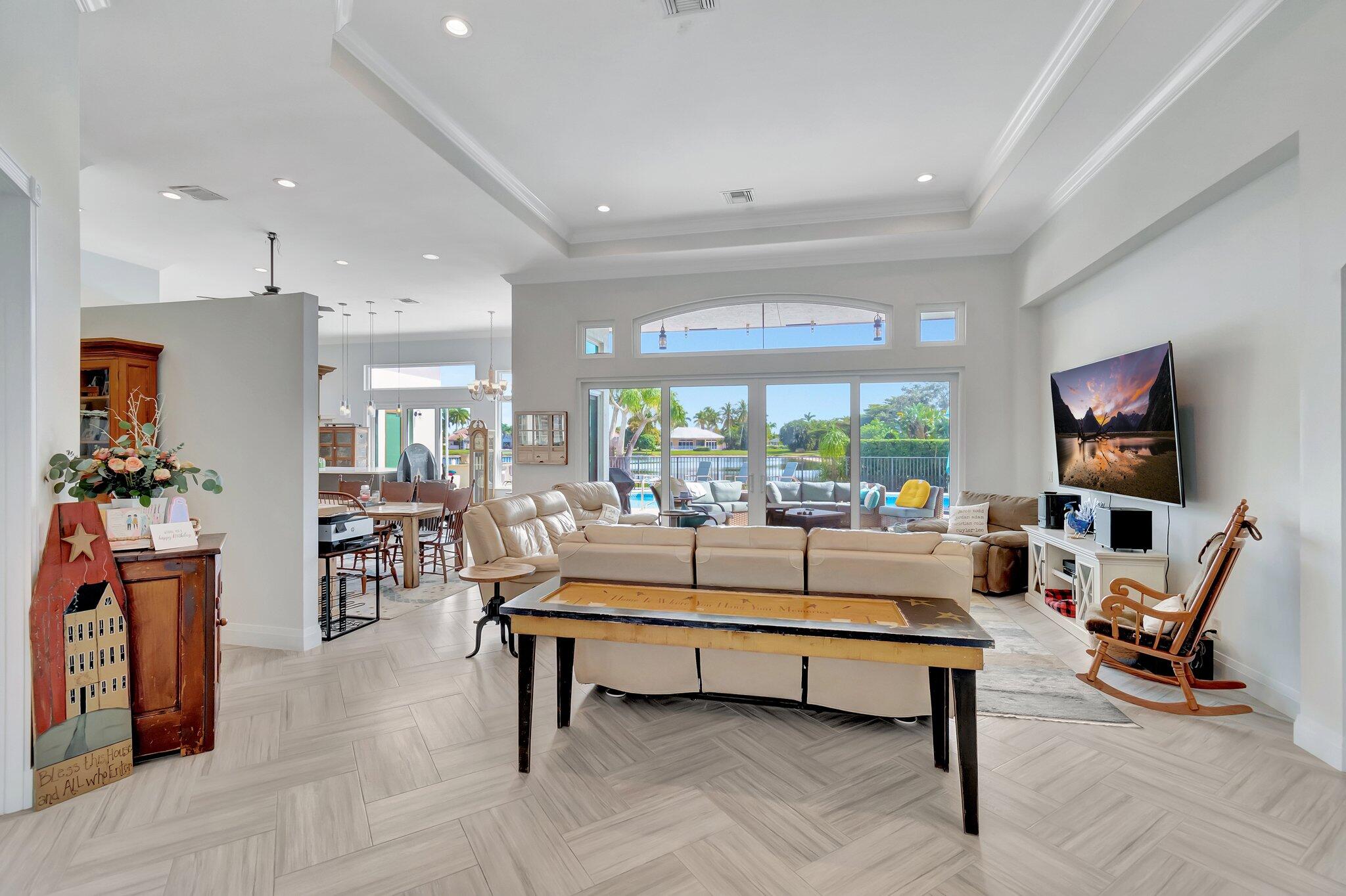 8200 Muirhead Circle Boynton Beach, FL 33472 - Photo 7 of 110 a living room with furniture a rug and a large window