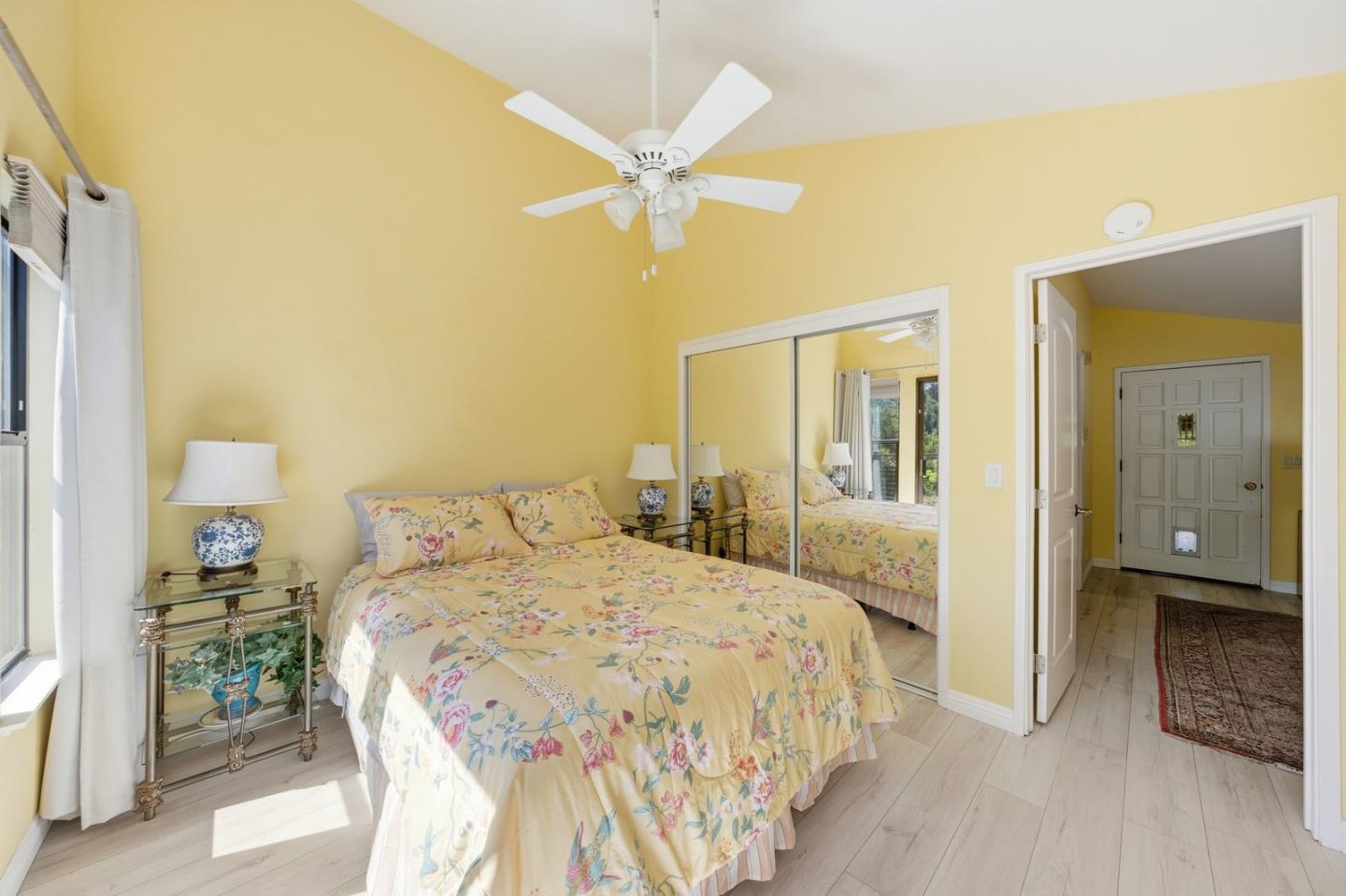 701 Day Valley Road Aptos, CA 95003 - Photo 33 of 43 a bedroom with a bed and a chandelier