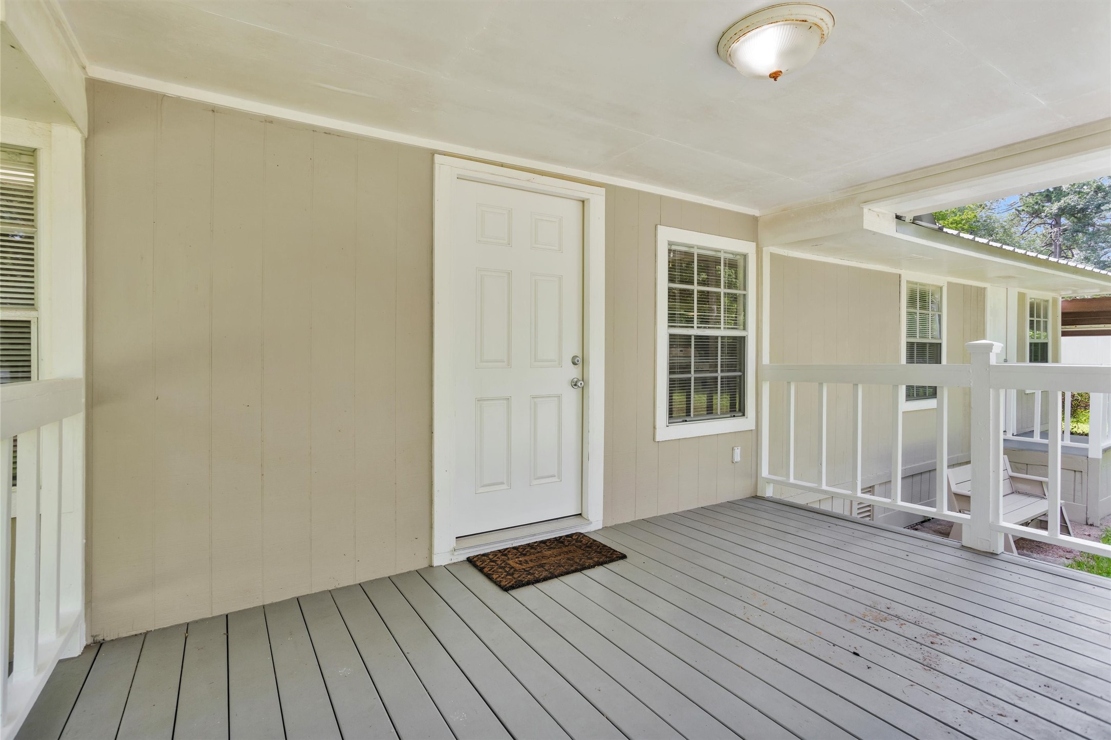 99 Main Street Huntsville, TX 77340 - Photo 7 of 47 This porch is perfect for relaxing without the worries of the sun.