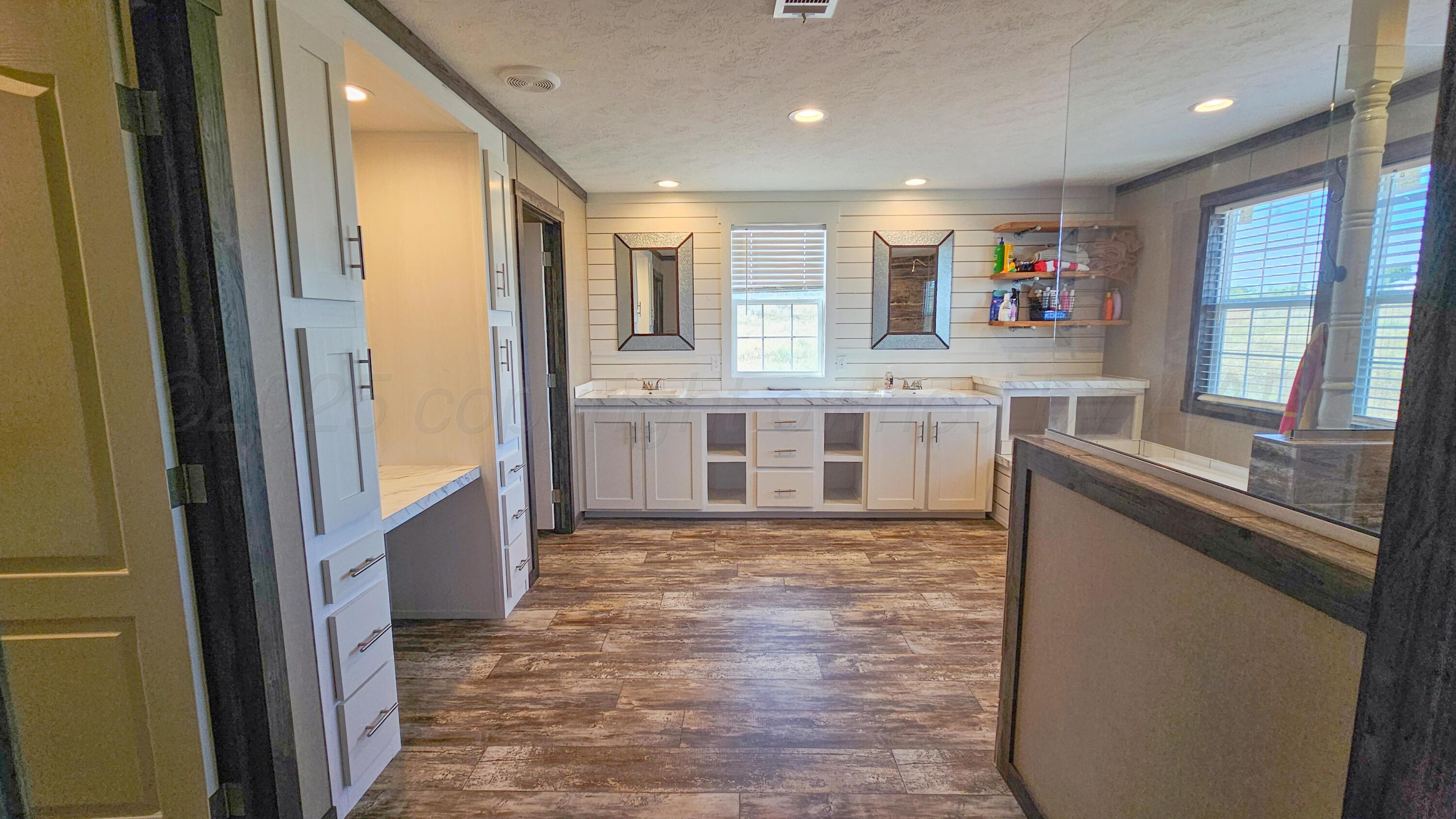 24490 RM 1061 Amarillo, TX 79124 - Photo 17 of 32 a large kitchen with stainless steel appliances granite countertop a refrigerator and a sink