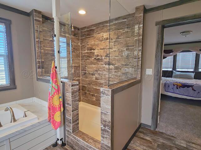 24490 RM 1061 Amarillo, TX 79124 - Photo 19 of 32 a bathroom with a bathtub and a shower